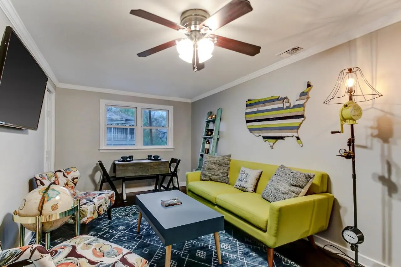 Vibrant, Colorful Building With Backyard Firepit And Games Daire