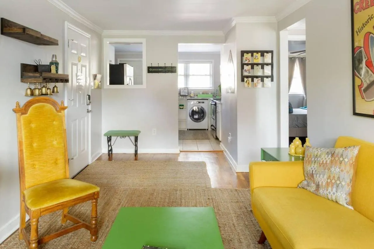 Vibrant, Colorful Building With Backyard Firepit And Games Savannah