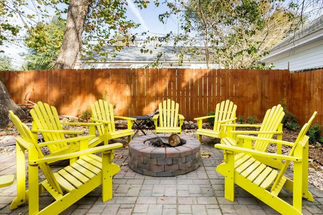 Vibrant, Colorful Building With Backyard Firepit And Games Apartment