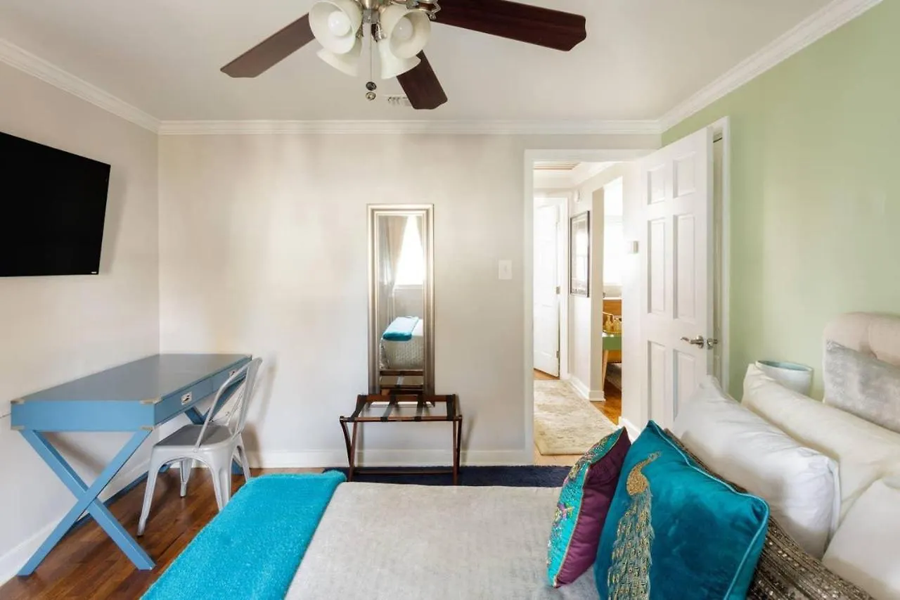 Vibrant, Colorful Building With Backyard Firepit And Games Savannah